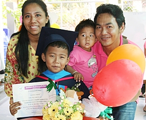 After nine years at school this young lady has no problem filling in the application form.